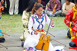 Mongolian people in traditional costumes