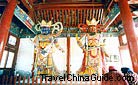 Colorfully glazed clay Heavenly King figures inside the hall, Xiangguo Temple.