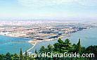 The verdant Western Hills overlooks the blue Dianchi Lake.