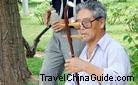 Senior citizens playing the urheen in the park