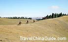 Travlers can take a horseback tour with a Kasak guide over the mountains.