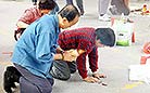 A close-up of worshippers in Wong Tai Sin Temple, Hong Kong