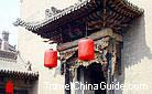 Subtling wooden carving on the door lintel reveals the architectural style of residence in the Qing Dynasty (1368-1644), Pingyao.