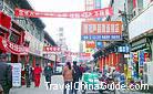 In the street, you can see various billboards with names of shops on, Taiyuan City.