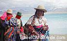 O, how beautiful this Tibetan woman is in her traditional costume! O, sister, you are altogether beautiful! There is no flaw in you!