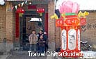 A well-decorated lantern is placed in front of the gate to add festive atmosphere.