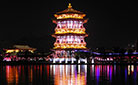 The reflections of the tower, pavilion and corridor in the lake look so amazing at night.