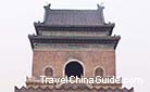 Beijing Bell Tower standing near behind the Drum Tower is a 33-meter-high building with gray wall and dark glazed title roof.