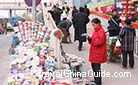 Reading at a newsstand founded along the 2nd Ring Road of Beijing