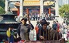 Devout people burn incense and worship the Gods in the Wong Tai Sin Temple, Hong Kong.