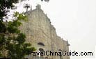 The tourists climb the Ruins of St. Paul's Church to appreciate its beauty closely.