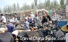 The Uygur men were enjoying the specialty fruit of Xinjiang, the hami melon.