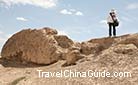 A visitor stands in the old Great Wall to fell its long history. However, the Wall have become shoter and some sections even have disappeared. Saving the sections in Shandan a must to maintain the Wall's continuity. If something is not done soon, we will be losing hundreds of meters of wall a year.