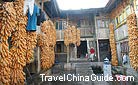 A local residence with hanging corns shows the typical Tunpu Culture of Jichang Village.