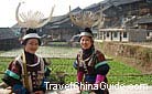 Beautiful Miao girls wearing their traditional costumes and delicate silver headgears, Qingman Miao Village, Kaili, Guizhou.